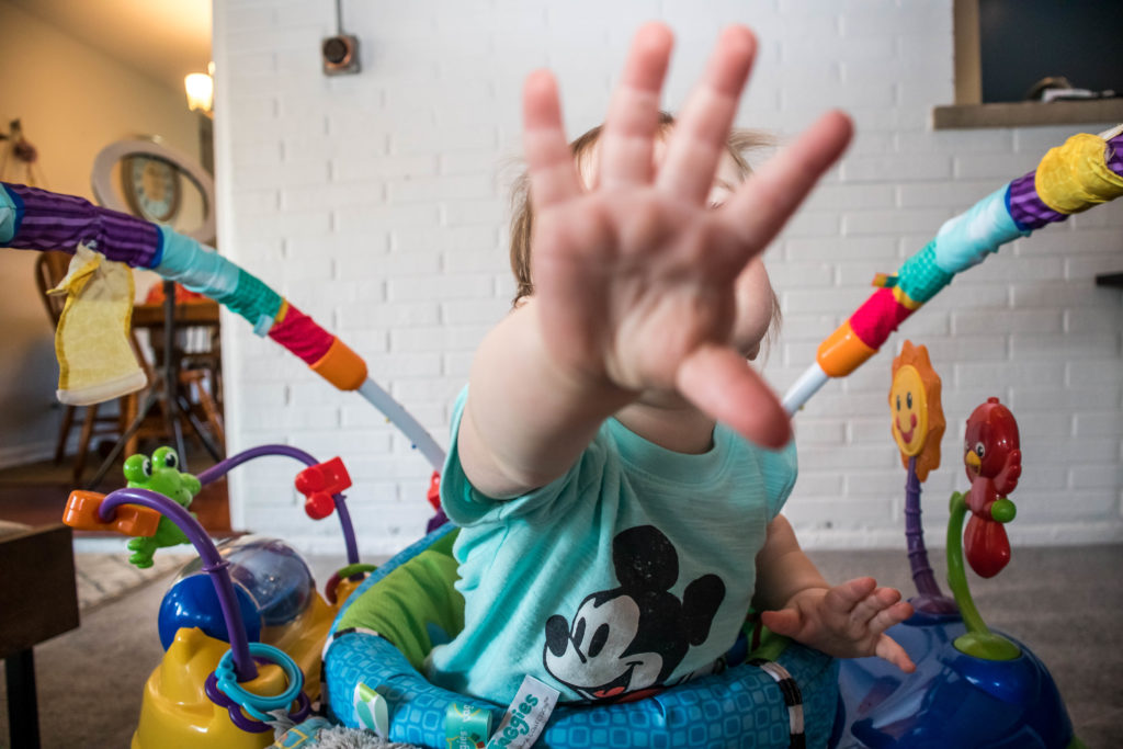 Baby plays in his activity center | working from home with a baby