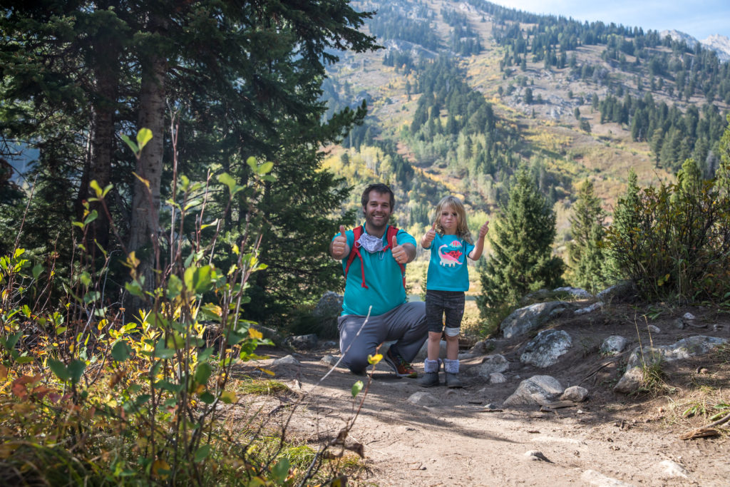 Dad and daughter posing on the Moose Ponds Trail at Jenny Lake | best hikes for kids in Grand Teton