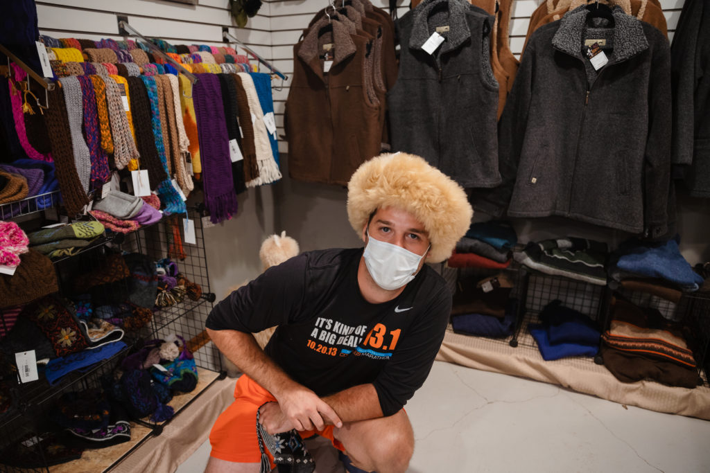 shopping for alpaca hats at a Harvest Host alpaca farm in Kansas