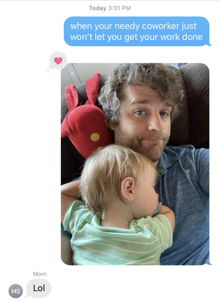 Text message with picture of baby sleeping on dad, text reading "when your needy coworker won't let you get your work done"