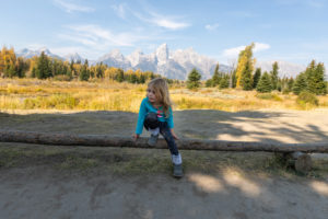 4 year old playing in front of the Teton Mountains at Schwabacher's Landing