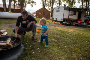 dad and son getting ready to cook dinner at the Longhorn Ranch and RV Resort in Dubois, Wyoming