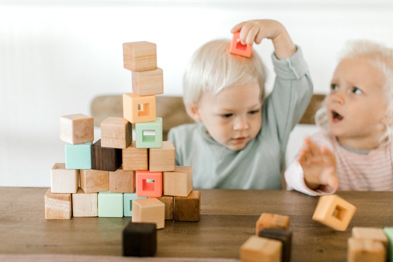 Wood and silicone block set for toddlers encouraging balance and stacking