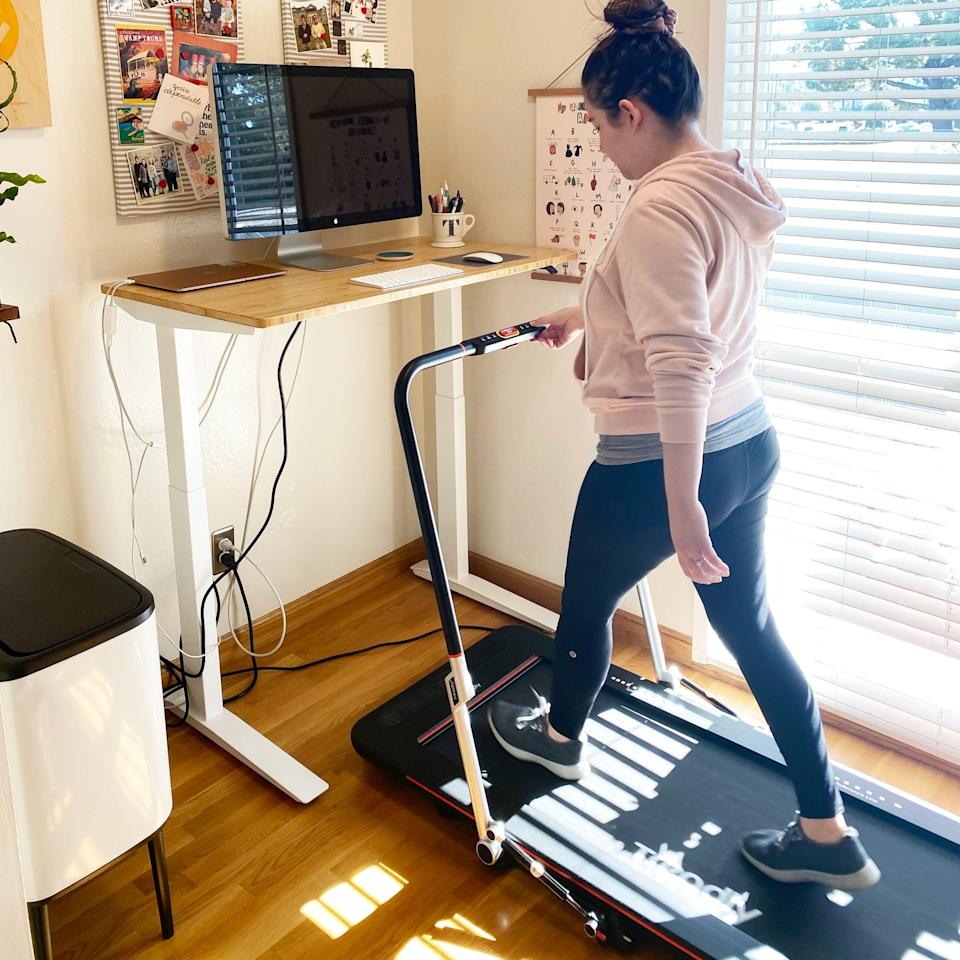 woman getting steps with treadmill desk